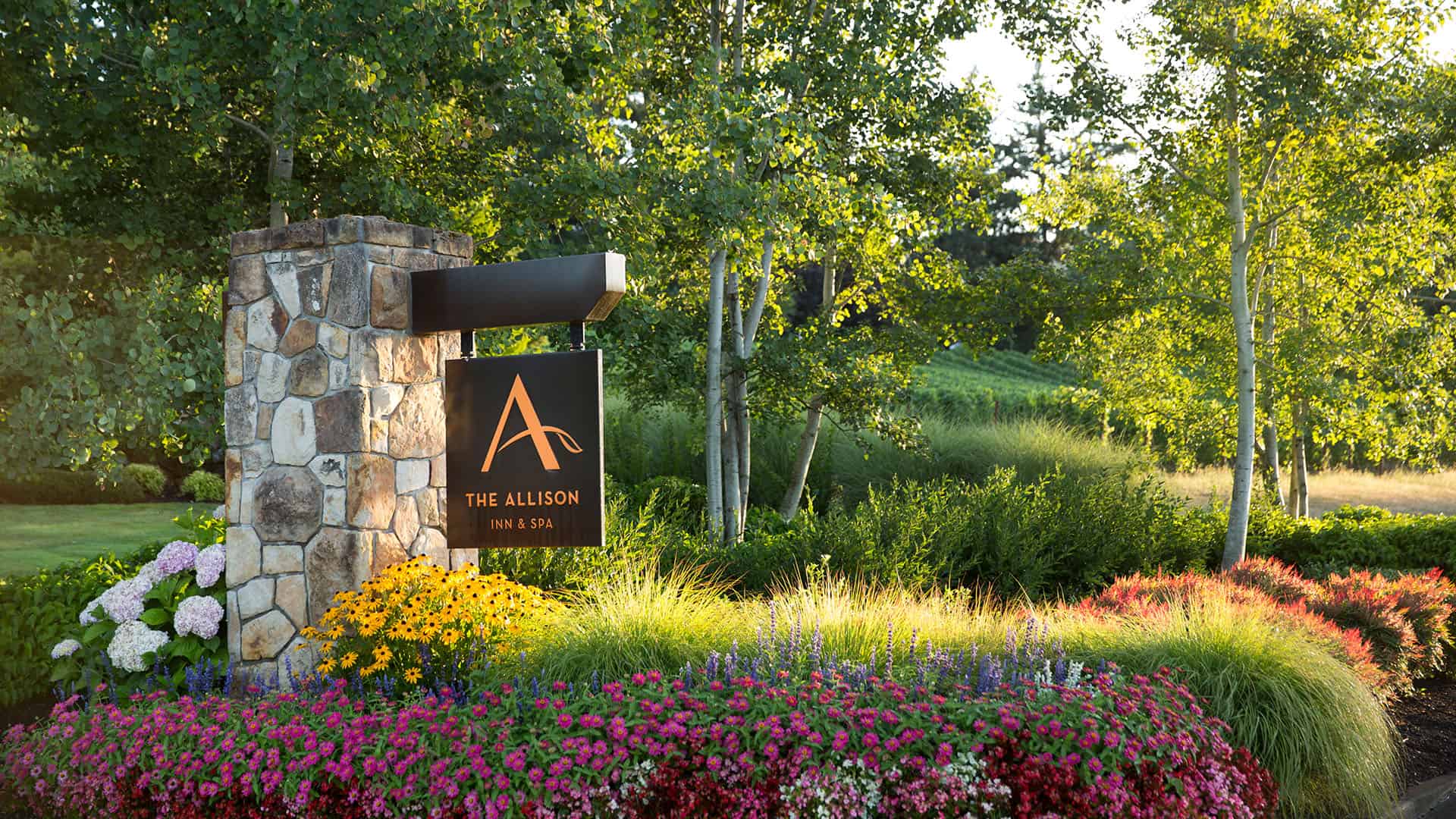 The Allison Inn and Spa Sign With Colorful Flowers
